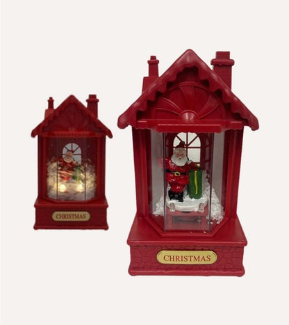 Nancy's Gxmas Kerstlantaarn met Bewegende Sneeuw - Kerstman Kersttafereel - Rood - Kerstdecoratie op Batterijen - LED Verlichting en Muziek - 20 cm